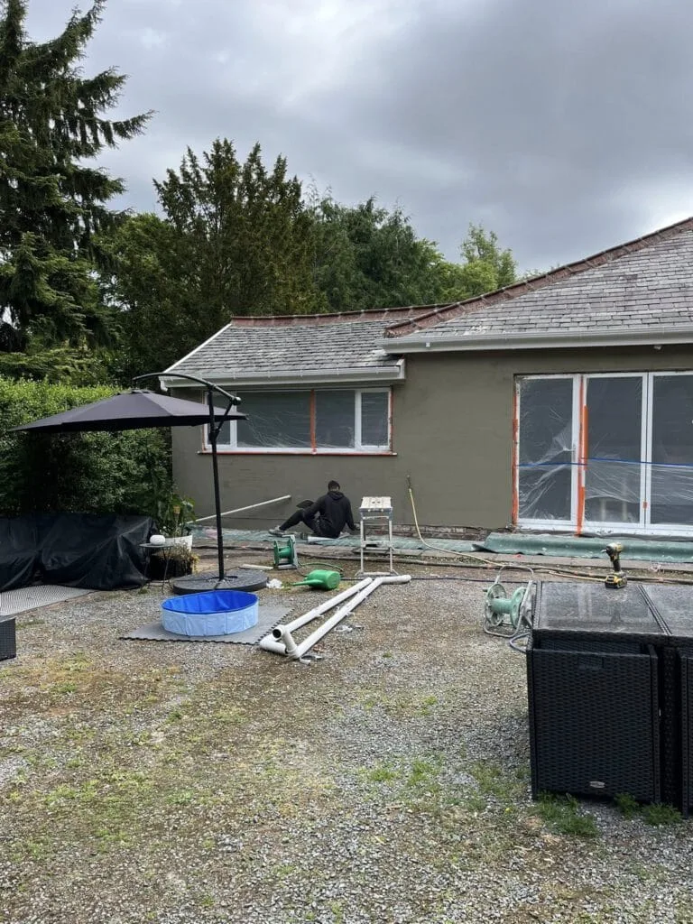 Dark grey silicone render application rear elevation
