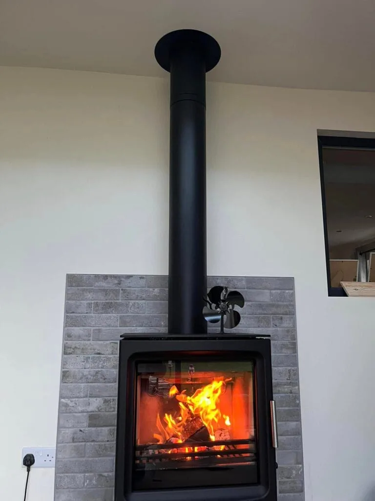 Modern wood burning stove installation flue
