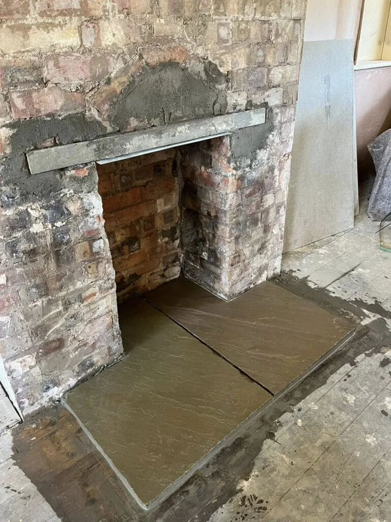 Stone hearth installation before stove fitting
