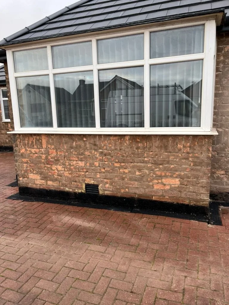 Weathered brick wall before external rendering