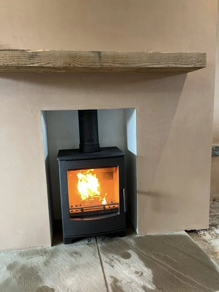 Wood burning stove installed plastered chimney